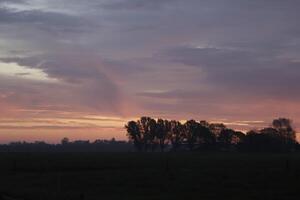 cloudy sunrise in the netherlands photo