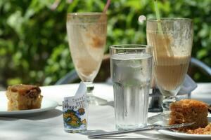 drinking ice coffee with baklava pie photo