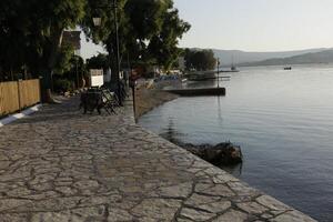 harbor with restaurants in lygia, lefkada, greece photo