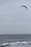 beach in the winter, kitesurfing, in the netherlands photo