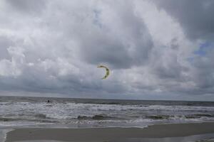 cloudscape, village petten at the north sea, the netherlands, photo