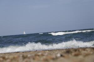 no straight horizon, it feels like you are swaying on the wavessailboat at sea, waves on the coast photo