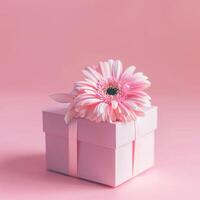 Pink gift box with spring flowers on pink background. photo