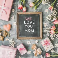 Mother's Day gift and greeting message in a small black board. photo