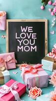 Mother's Day gift and greeting message in a small black board. photo