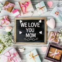 Mother's Day gift and greeting message in a small black board. photo