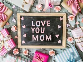 Mother's Day gift and greeting message in a small black board. photo