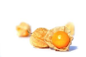 Cape gooseberry on white background. it is one of the best berries. It is a plant in the same family as eggplant. Rich in nutrients and high in vitamins. Soft and selective focus. photo