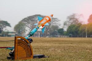 water rocket on launch pad. It is an activity that promotes science knowledge and skills for children. Children have thinking skills, problem-solving, creativity, happiness, and fun. photo