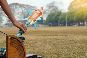 water rocket on launch pad. It is an activity that promotes science knowledge and skills for children. Children have thinking skills, problem-solving, creativity, happiness, and fun. photo