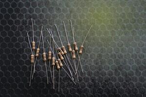 Resistors are electronic devices that control the amount of current and voltage between two points in a circuit. Soft and selective focus. photo