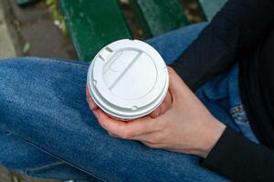 Couple clinking hot coffee cups photo