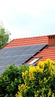 Installing a Solar Cell on a Roof. photo