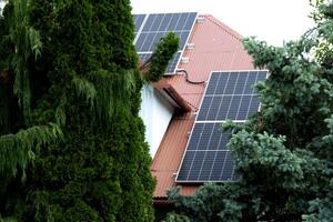 Installing a Solar Cell on a Roof. photo