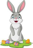 Cute little bunny with Easter egg ion the grass vector