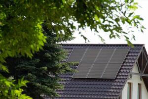 Installing a Solar Cell on a Roof. photo