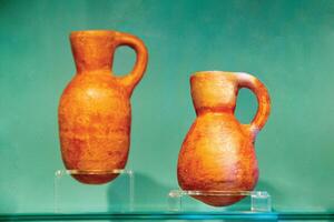 Antique ceramic decorative amphora on a white background photo