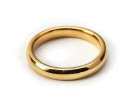 Single golden wedding ring on white background photo