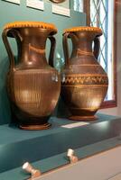 Antique ceramic decorative amphora on a white background photo