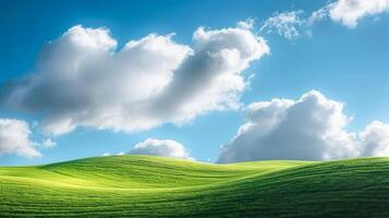 Landscape with clouds resting on a green hillside in sunlight. photo