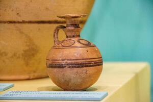 Antique ceramic decorative amphora on a white background photo