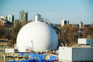 Big gas container against the blue sky photo