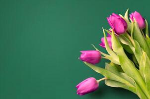 Bouquet of beautiful tulips on wooden background. Tulips on old boards photo