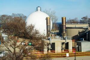 Big gas container against the blue sky photo