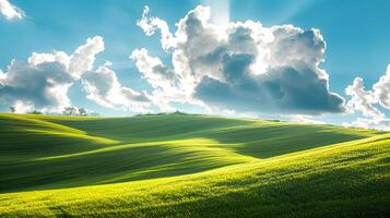 Landscape with clouds resting on a green hillside in sunlight. photo