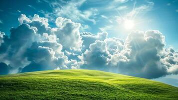 Landscape with clouds resting on a green hillside in sunlight. photo