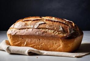 a loaf of bread sitting on a cloth photo