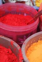 colorful powders to make mandalas on the streets, use for tikka, holi, and many other hindi events photo