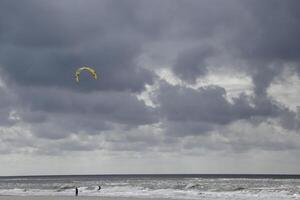 cloudscape, village petten at the north sea, the netherlands, photo