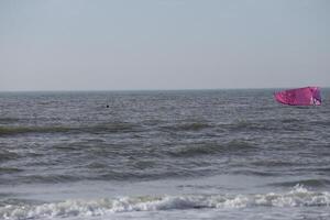 beach in the winter, kitesurfing, in the netherlands photo