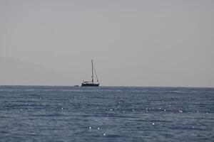 rented boat trip on the sea, sailing along the coast photo