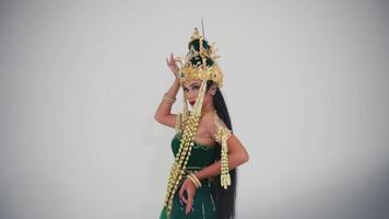 Traditional Balinese dancer in costume performing cultural dance video