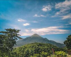 a view of the mountains from the top of a hill photo