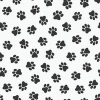 seamless pet paw pattern - cute funky design. Black and white animal footprints background vector