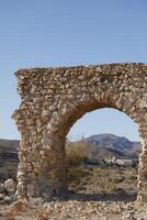 roman aqueduct in antas, spain photo