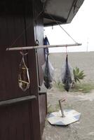 freshly caught fish hangs to dry photo