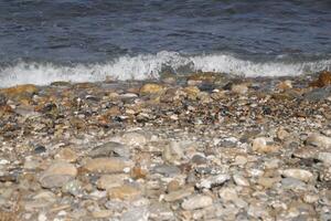 waves crash on the shore photo