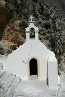 bell and cross of a church photo