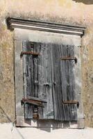 old window at an old house in an old village, corfu, greece photo