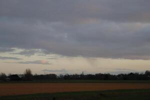 sunset in the netherlands, clouds, colors photo