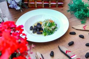 Abundant Feast White Plate Brimming With Food on Wooden Table photo