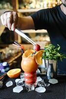 Bartender Mixing a Cocktail at the Bar photo