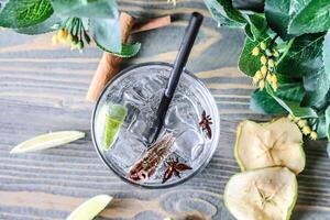 Glass With Drink on Wooden Table photo