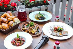 Wooden Table Adorned With Delectable Plates of Food photo