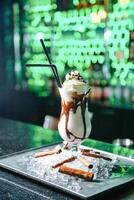 Chocolate Milkshake on Plate on Table photo