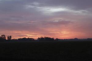 cloudy sunrise in the netherlands photo